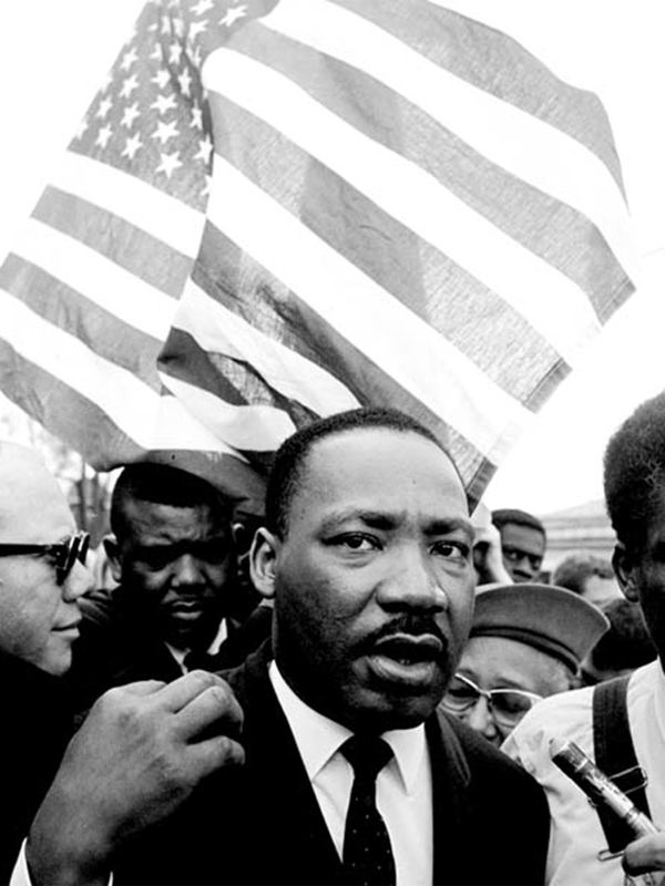 Martin Luther King jr. with Flag during the Selma March Selma, Alabama, 1965